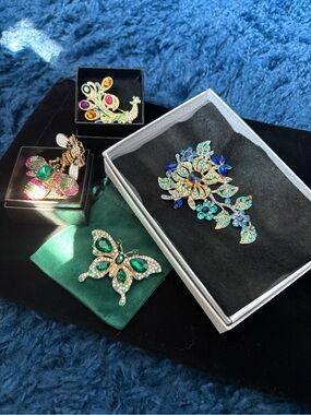 Gold-Tone Floral Crystal Brooch with Blue & Teal Accents
